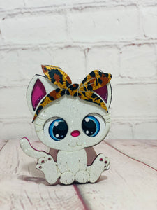 Cat with bow shaker